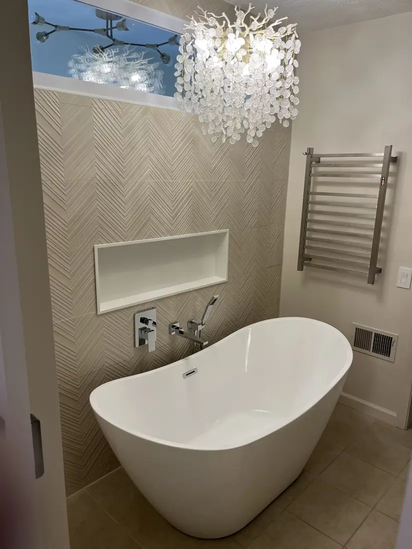 Bathroom remodel with a freestanding tub and tiled niche, by Greg